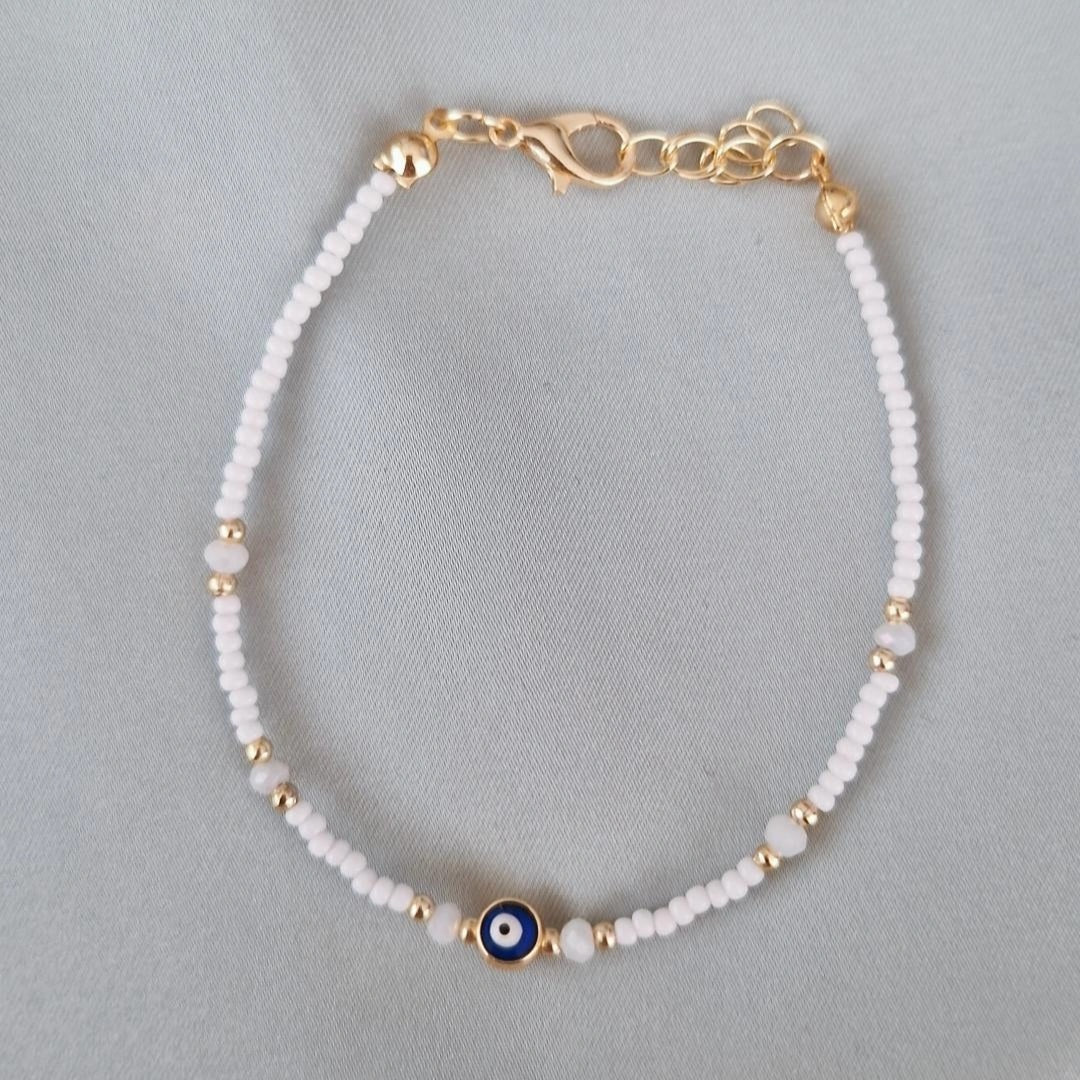 Bracelet fantaisie perles blanches et dorées œil