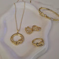 Ensemble Jaguar Collier + bracelet jonc + boucles d'oreilles + bague assortis
