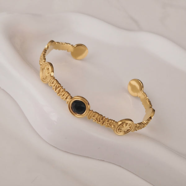 Bracelet jonc en acier inoxydable soleil et pierre noire