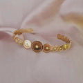 Bracelet jonc en acier inoxydable motifs et pierre jaune