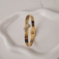 Bracelet jonc en acier inoxydable double lignes et strass