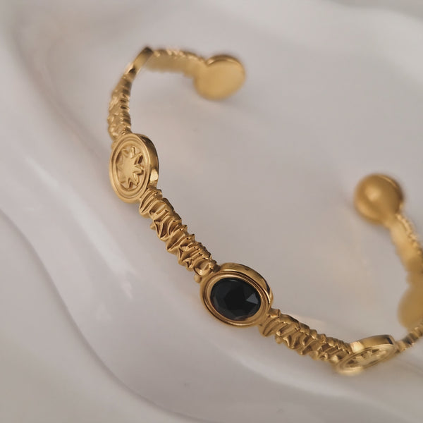 Bracelet jonc en acier inoxydable soleil et pierre noire